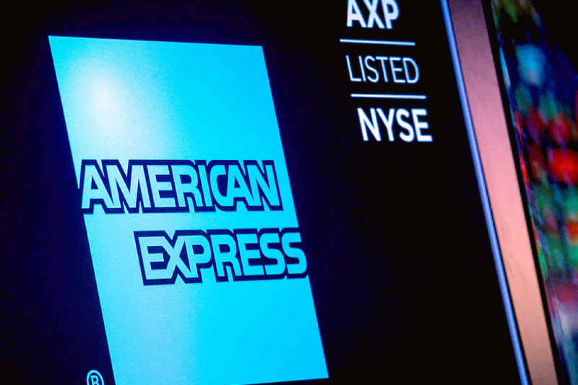 American Express credit spending slump eclipses better profit figures